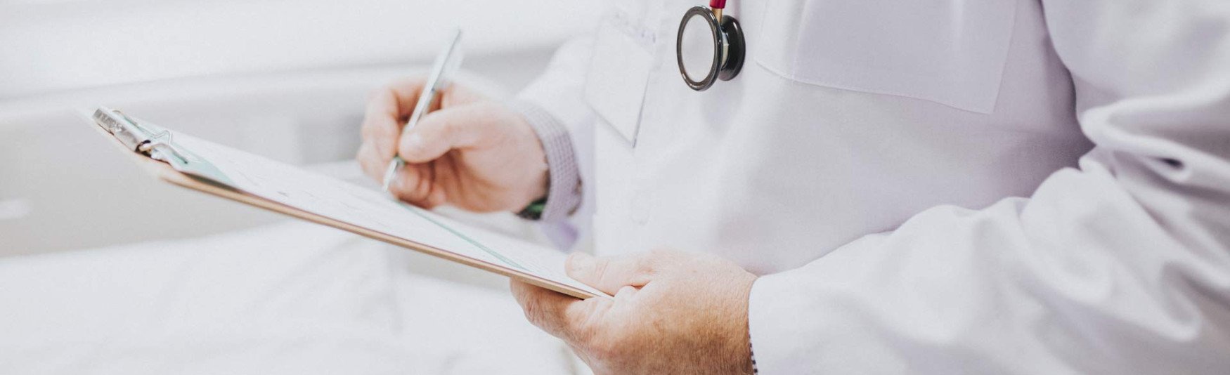 Hospital doctor with a patient chart